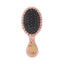 Refect Beauty Wet Brush mini detangling hairbrush in pink with gold geo hearts pattern and flexible black bristles