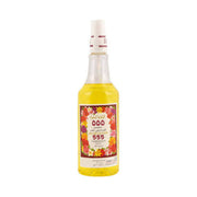 A bottle with a white cap and a colorful label featuring red, pink, and yellow flowers, containing a golden-colored liquid.