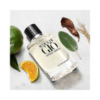 Refect Beauty Giorgio Armani Acqua Di Gio Eau de Parfum bottle surrounded by fresh green mandarin and sage leaves.