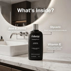 Refect Beauty Adams invigorating shower gel bottle on a marble bathroom counter with ingredient highlights