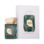 Refect Beauty French Avenue Aether extrait de parfum bottle with geometric green glass and gold cap next to its box