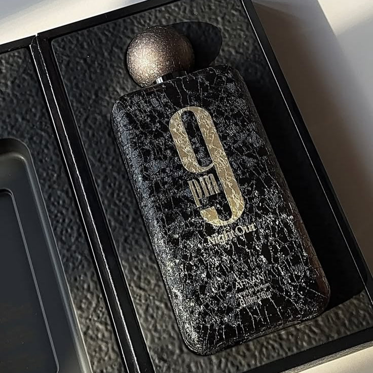 Refect Beauty Afnan 9 PM Night Out extrait de parfum in a black textured bottle with gold lettering in a gift box.