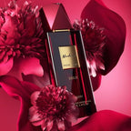Refect Beauty Afnan Modest Deux Femme perfume bottle surrounded by vibrant dark pink flowers and flowing fabric