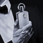 Refect Beauty Afnan Supremacy Silver perfume bottle held by a man in a black tuxedo and bowtie