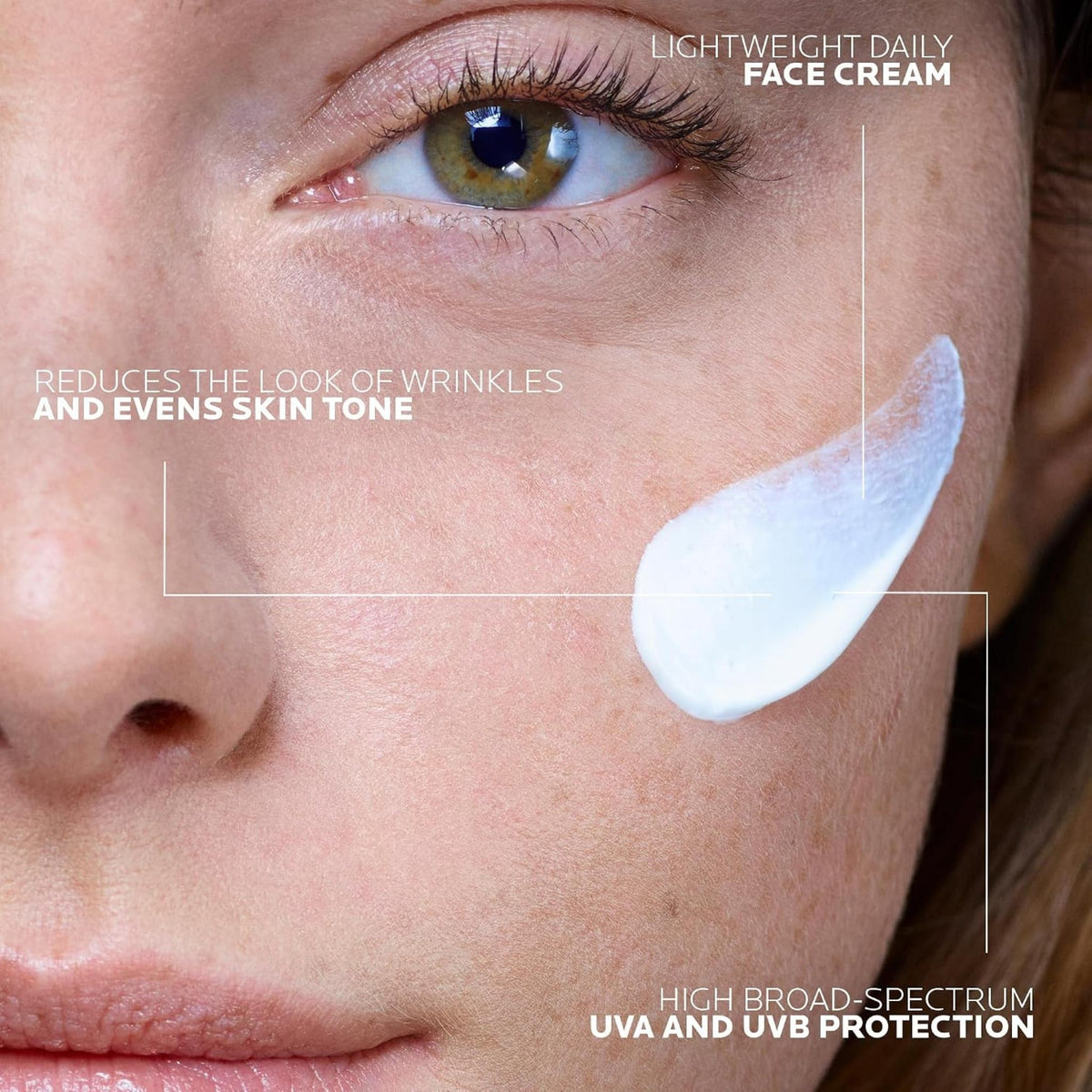 Refect Beauty La Roche-Posay Anthelios Age Correct SPF 50+ cream applied as a white swatch on a woman's cheek