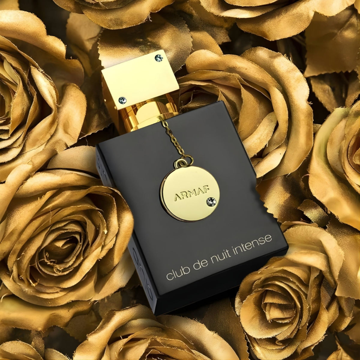Refect Beauty Armaf Club De Nuit Intense Women perfume bottle with gold cap and charm set against gold roses