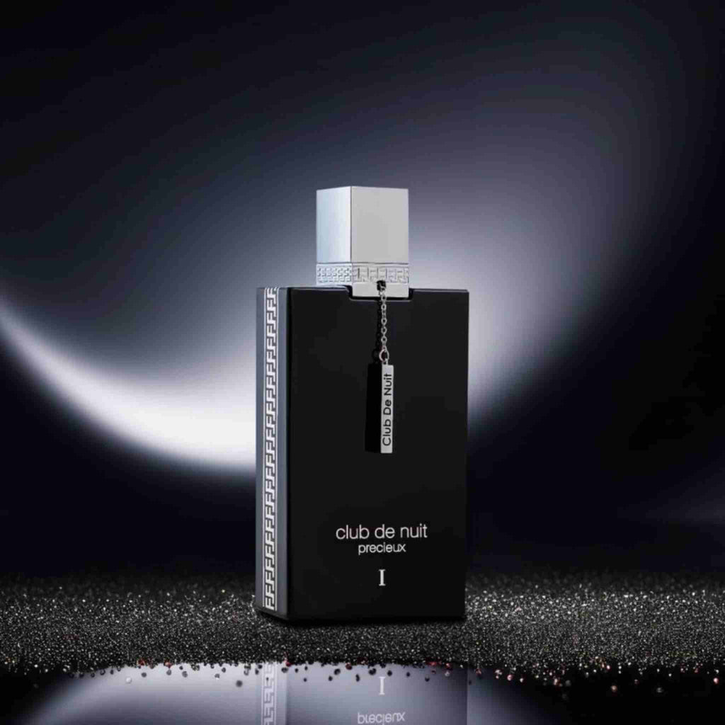 Refect Beauty Armaf Club de Nuit Precieux 1 Extrait de Parfum in a sleek black bottle with a silver cap and charm.