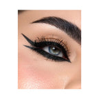 Refect Beauty Astra Black Glitter kajal eye pencil applied with a sharp winged eyeliner look on a blue-eyed model