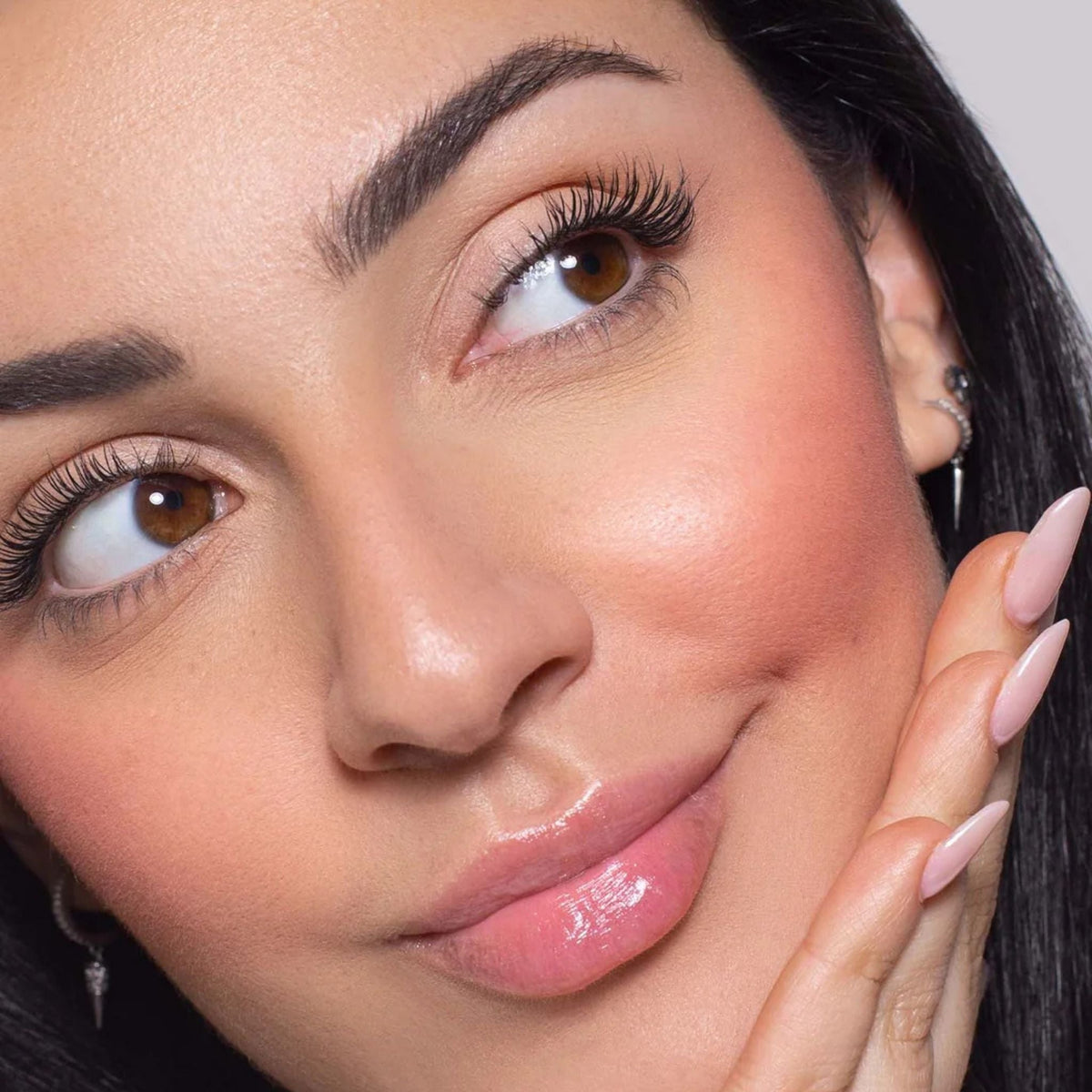 Refect Beauty model wearing Astra Blush Expert with a natural matte finish on her cheeks