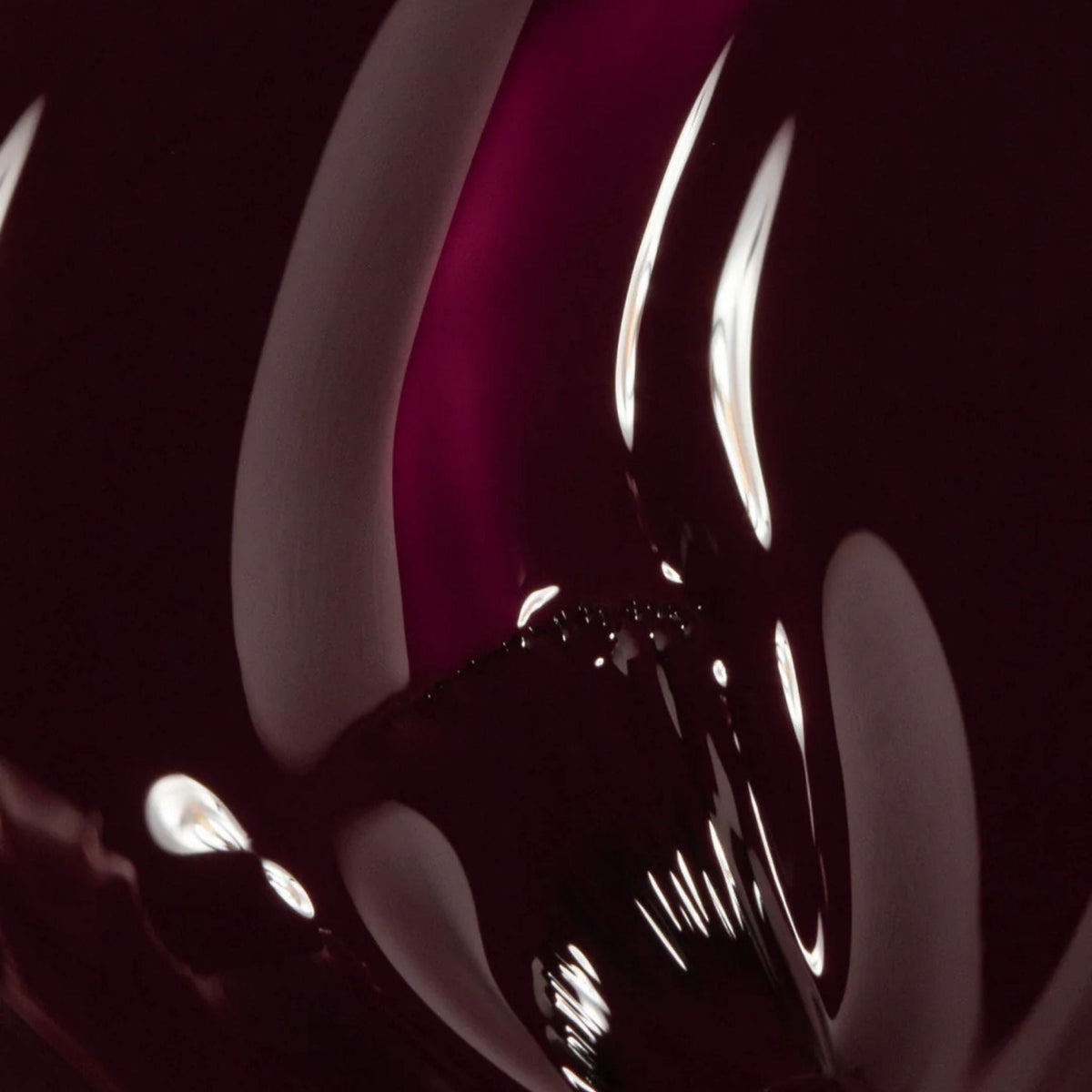 Refect Beauty Astra Lasting Gel Effect nail polish in a deep glossy burgundy shade with a high-shine finish.