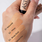 Refect Beauty Astra concealer cream stick showing four different skin tone swatches on a hand