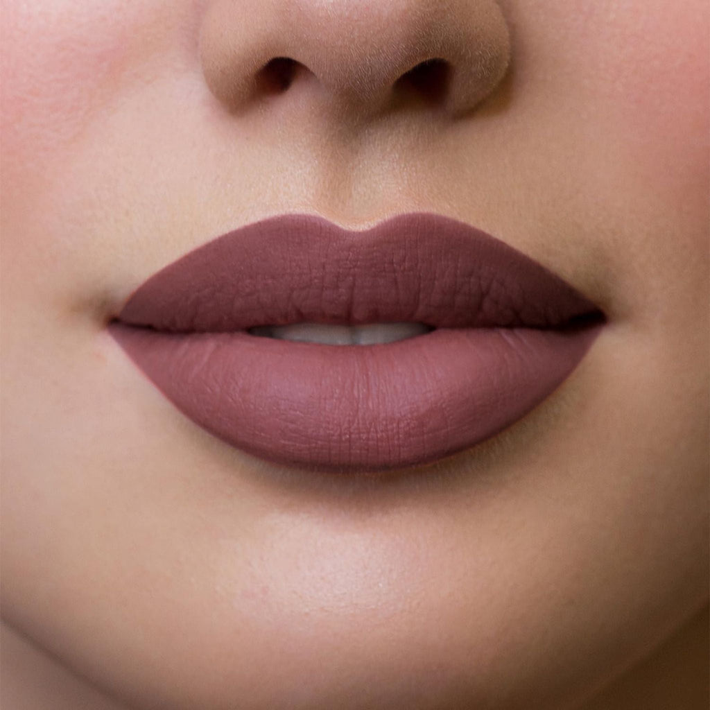 Refect Beauty Astra Hypnotize liquid lipstick in a matte mauve shade applied on model lips for a defined look