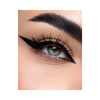 Refect Beauty Astra Ink Liner applied as a sharp black winged eyeliner on a blue-eyed model with groomed eyebrows.