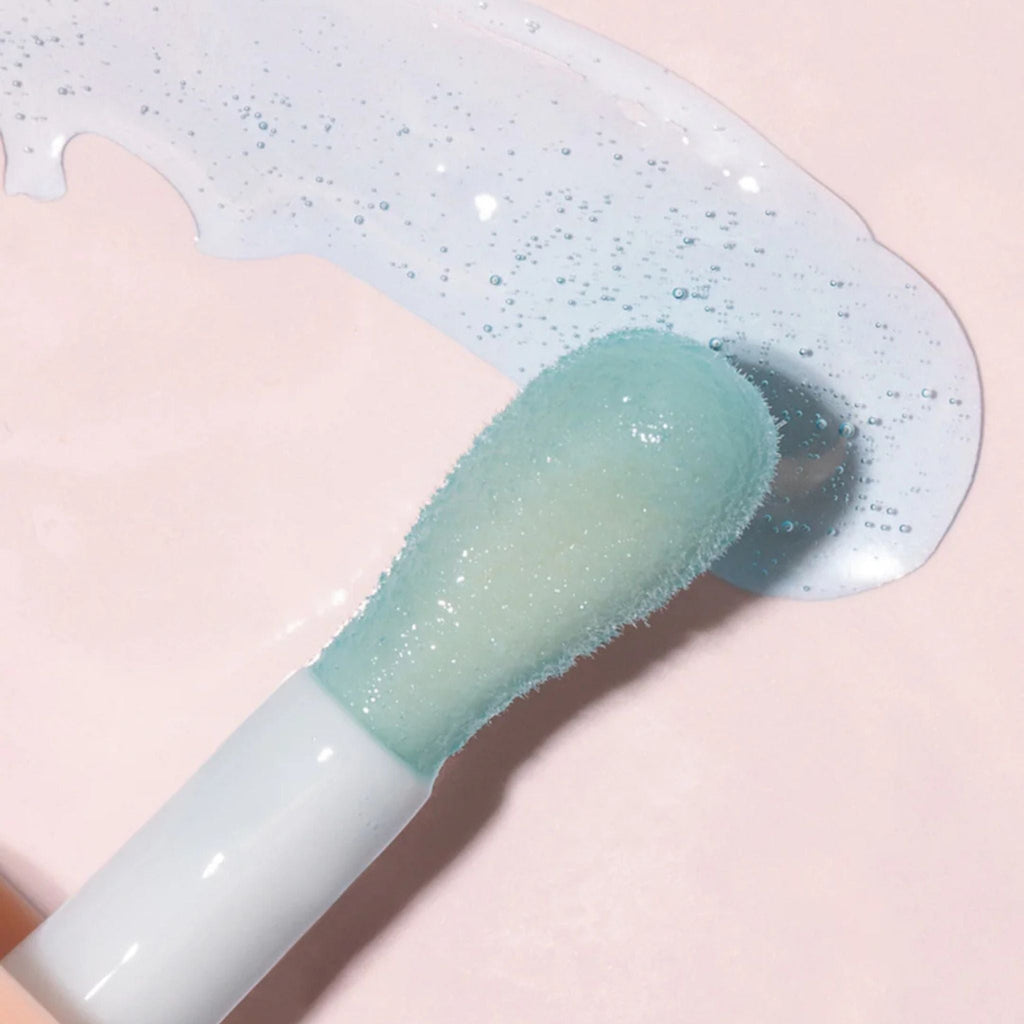 Refect Beauty Astra Pure Beauty Juicy Lip Oil in Forest Mint shade with a clear blue glossy texture and applicator