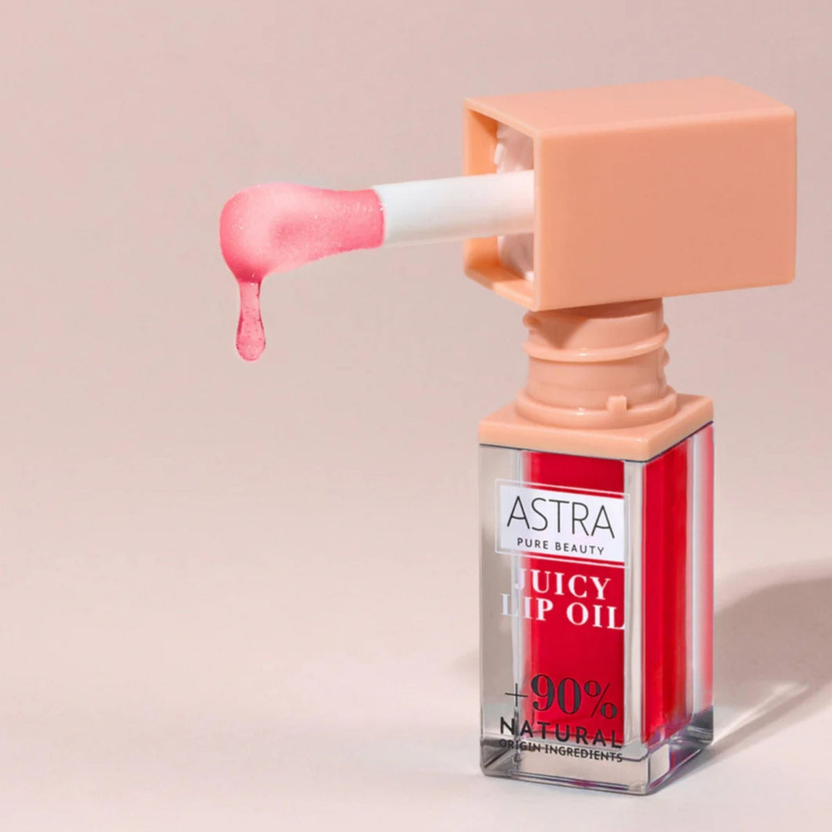 Refect Beauty Astra Pure Beauty Juicy Lip Oil in Red Oasis with a glossy applicator dripping vibrant red lip oil