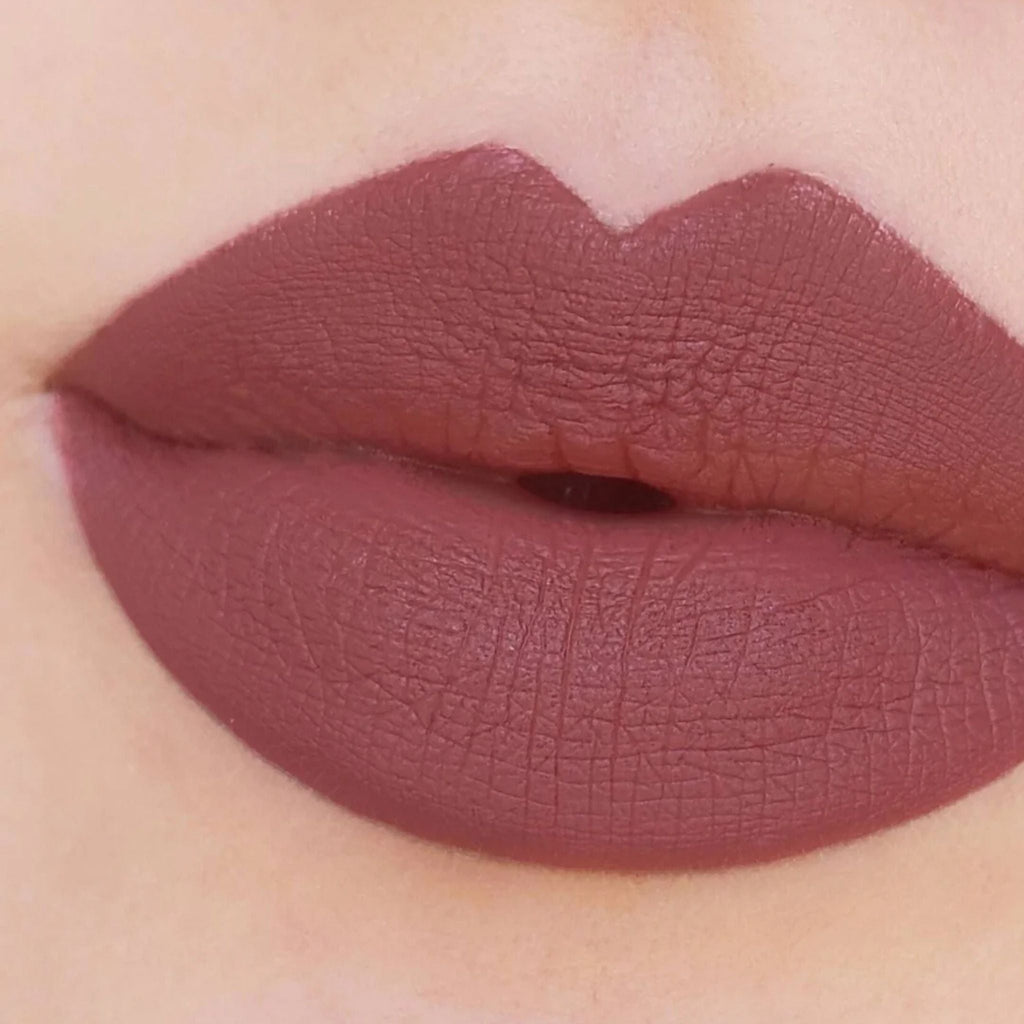 Refect Beauty Astra Jumbo Lipstick in a matte mauve shade applied to lips for a smooth, defined finish.