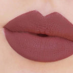 Refect Beauty Astra Jumbo Lipstick in a matte mauve shade applied to lips for a smooth, defined finish.