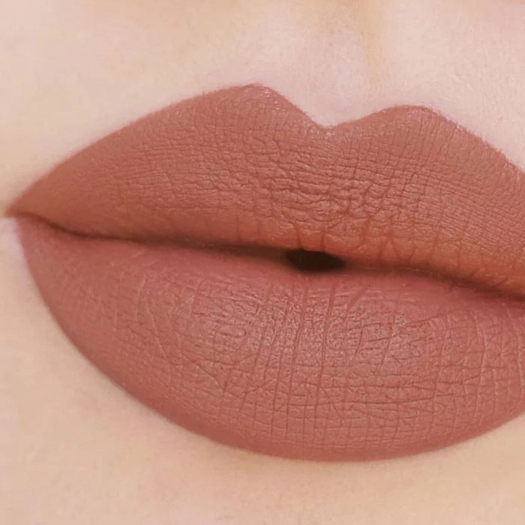 Refect Beauty Astra Jumbo Lipstick in a matte nude brown shade applied on lips for a smooth and defined finish