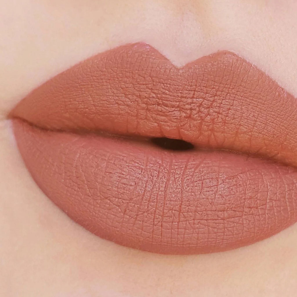 Refect Beauty Astra Jumbo Lipstick in a matte nude brown shade applied on lips for a smooth and defined finish