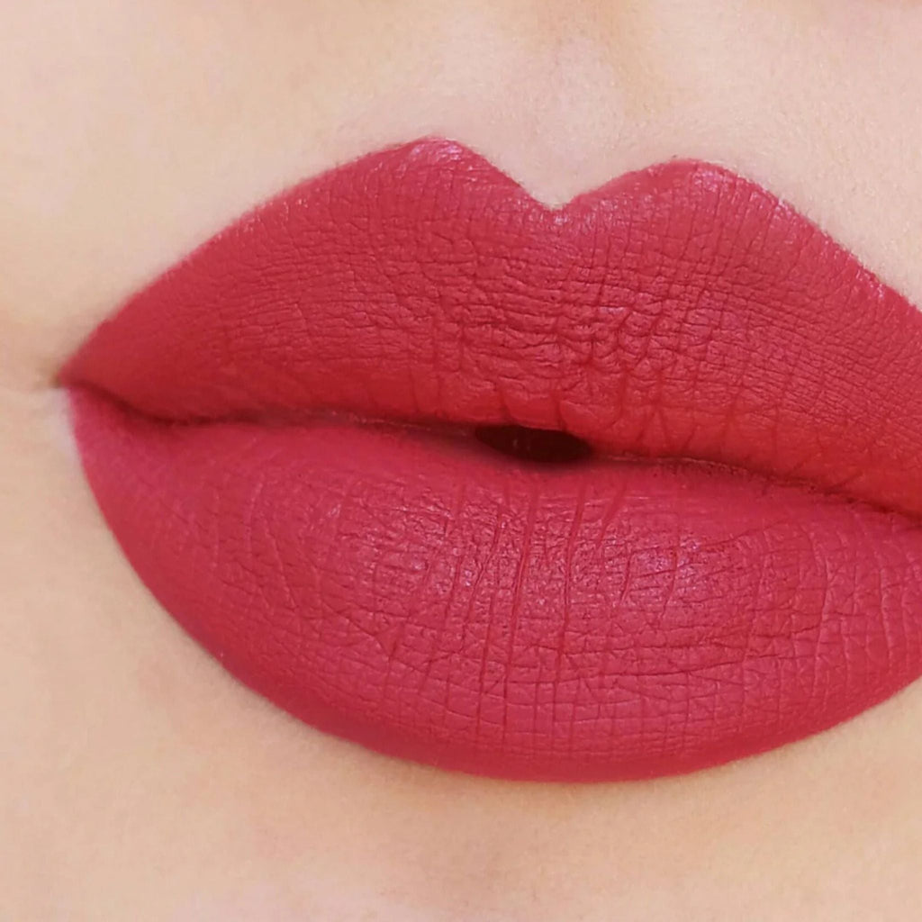 Refect Beauty Astra Jumbo Lipstick in a vibrant matte red shade applied smoothly on lips for a defined look.