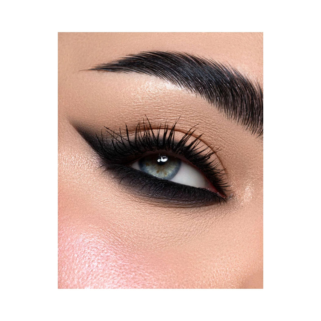 Refect Beauty Astra 24H Color Stain Pencil applied as a bold black winged kajal eyeliner on a blue-eyed model