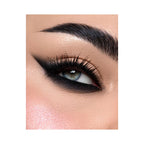 Refect Beauty Astra 24H Color Stain Pencil applied as a bold black winged kajal eyeliner on a blue-eyed model