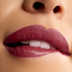 Refect Beauty Astra Lip Creamynal lipstick in a deep, luminous wine shade applied on lips for a plumped finish.