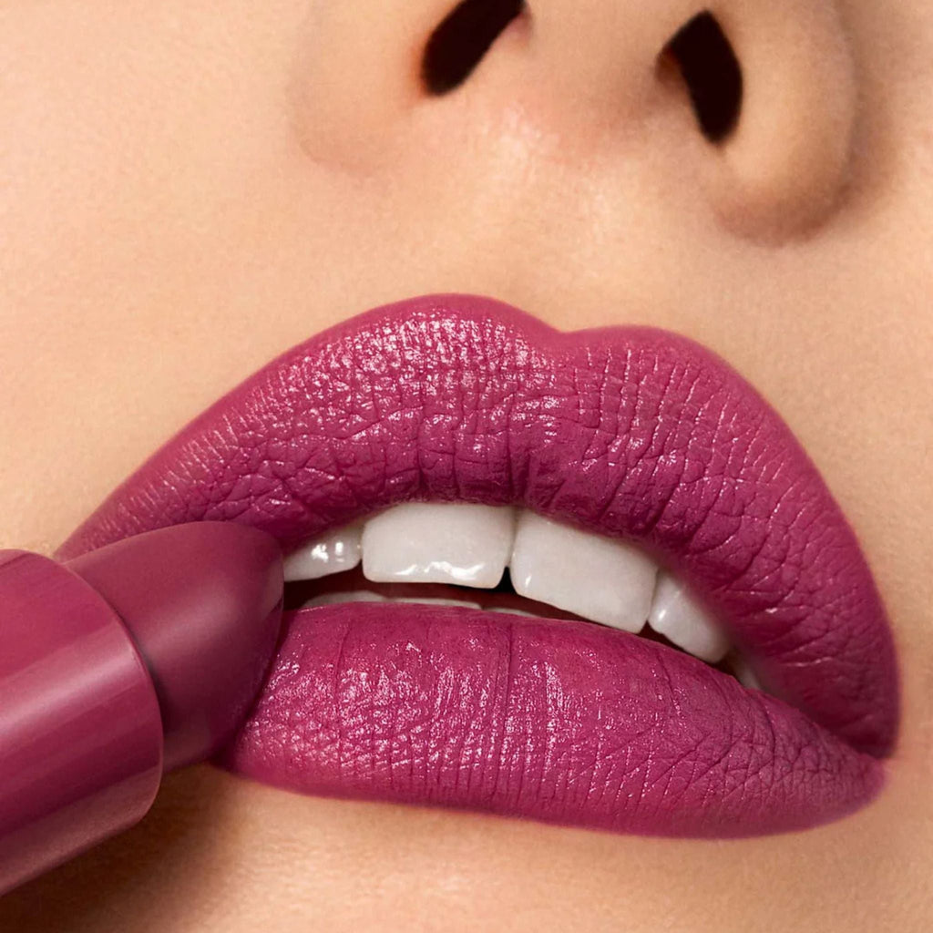 Refect Beauty Astra Lip Creamynal lipstick in a rich, desaturated berry shade applied on lips for a luminous finish.
