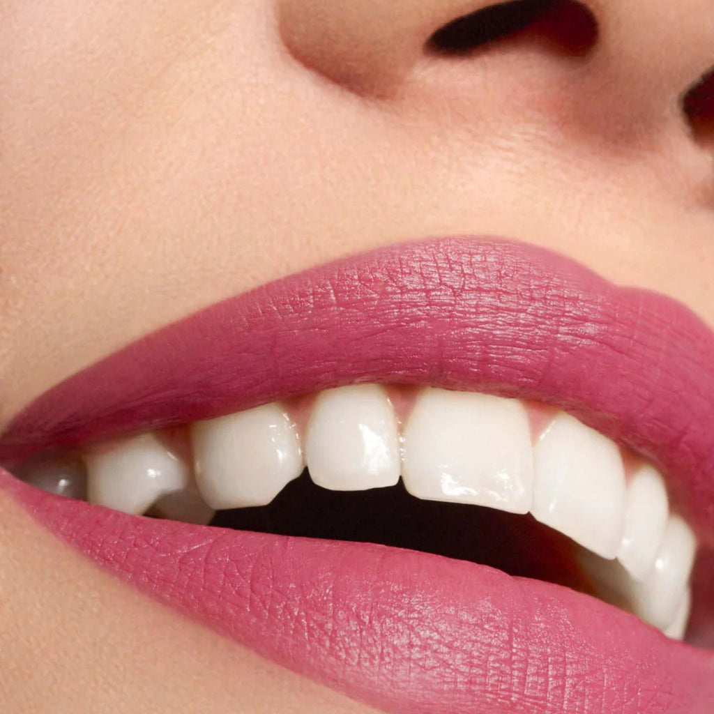 Refect Beauty Astra Lip Creamynal lipstick in a vibrant berry shade applied on lips with a luminous finish
