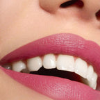 Refect Beauty Astra Lip Creamynal lipstick in a vibrant berry shade applied on lips with a luminous finish