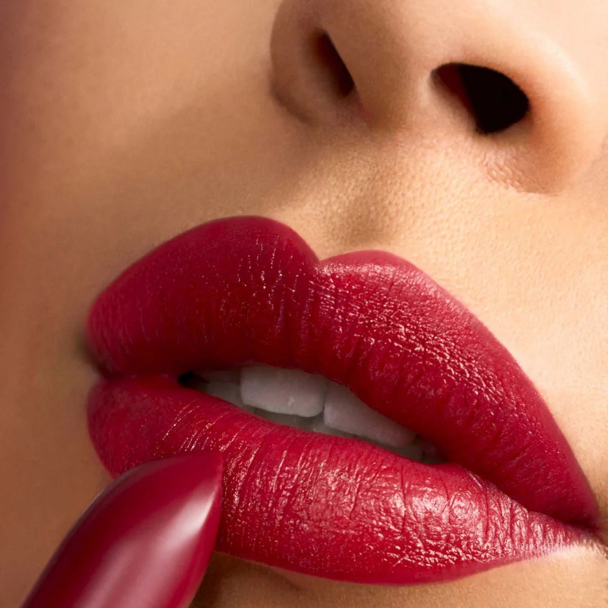 Refect Beauty Astra Lip Creamynal lipstick in an intense cherry red shade applied to lips for a luminous finish