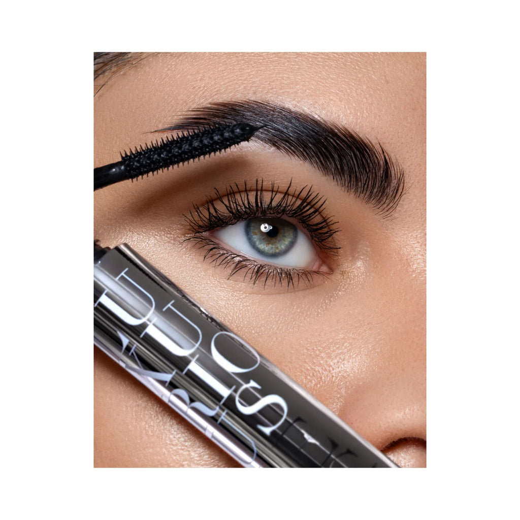 Refect Beauty Astra Luxurious Length mascara wand applying intense black formula to long, defined eyelashes