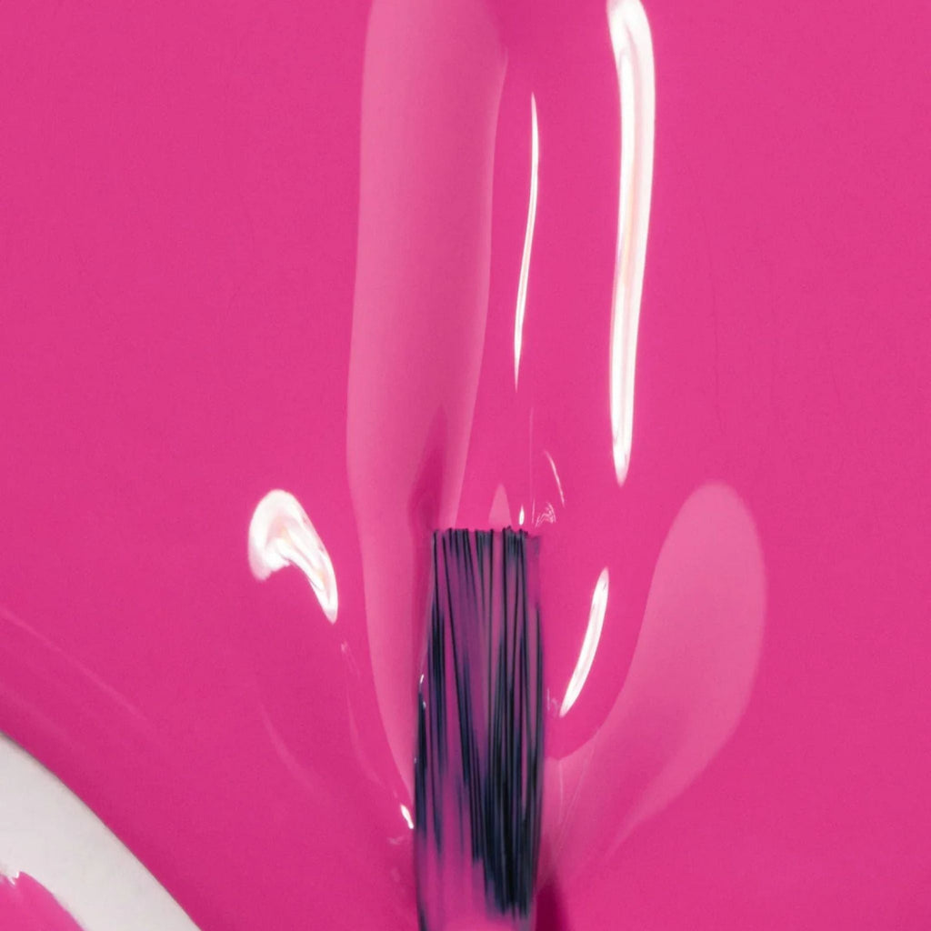 Refect Beauty Astra My Laque nail polish in a vibrant hot pink shade with a glossy, high-shine finish on a brush.