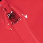 Refect Beauty Astra My Laque nail polish brush dripping with vibrant glossy red lacquer