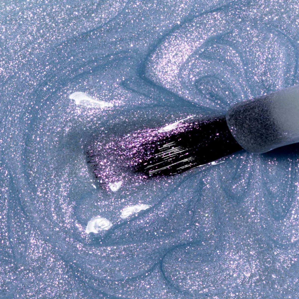 Refect Beauty Astra My Laque nail polish in a shimmering light blue shade with a high-shine glitter finish