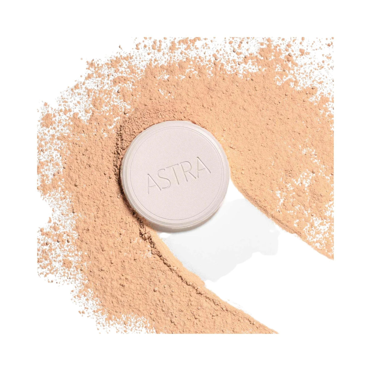 Refect Beauty Astra Natural Skin Powder in a compact case surrounded by loose beige face powder on a white background