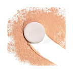 Refect Beauty Astra Natural Skin Powder compact surrounded by a swirl of loose beige face powder on a white background
