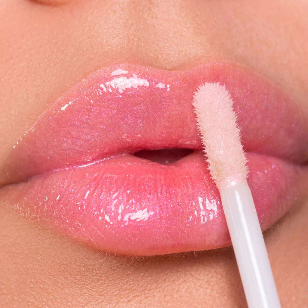 Refect Beauty Astra My Gloss Plump & Shine lip gloss in a shimmering pink shade with a 3D high-shine finish