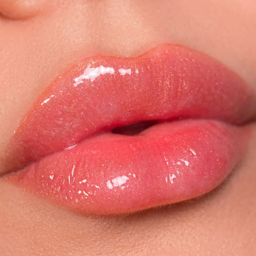 Refect Beauty Astra My Gloss Plump & Shine lip gloss in a shimmering coral pink with a high-shine 3D finish.