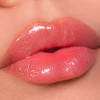 Refect Beauty Astra My Gloss Plump & Shine lip gloss in a shimmering coral pink with a high-shine 3D finish.