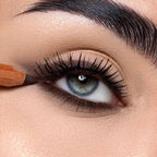 Refect Beauty Astra Pure Beauty Kajal eye pencil applying dark liner to the upper lash line of a blue eye