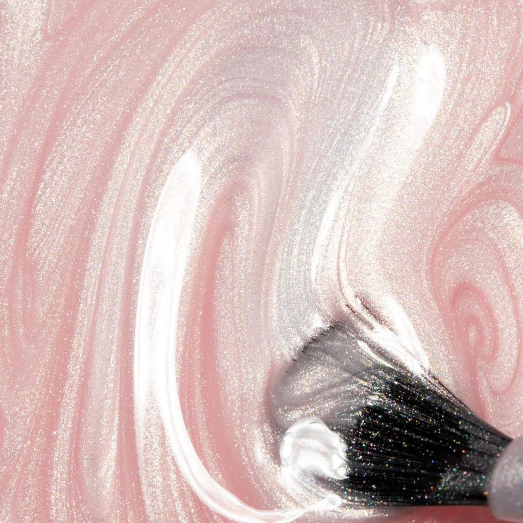 Refect Beauty Astra Lasting Gel Effect nail polish in a shimmering pale pink with a glossy, high-shine finish.