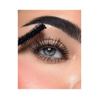 Refect Beauty Astra Subliminal Atomic Volume mascara wand applying black volumizing mascara to long eyelashes