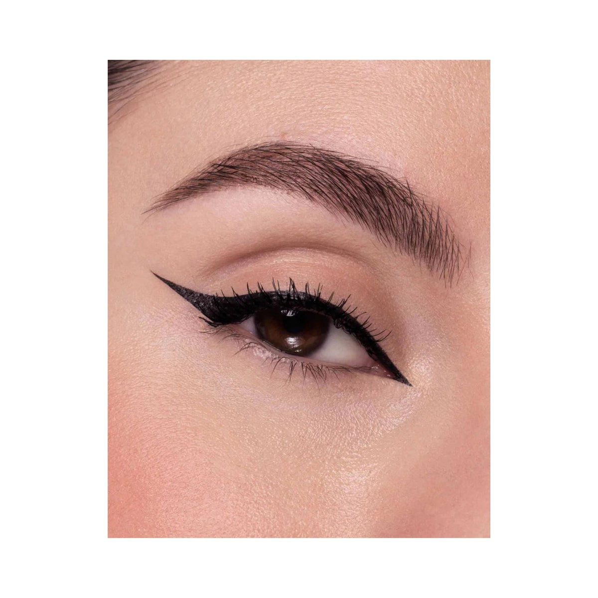 Refect Beauty Astra Vinyl Black eyeliner applied with a precise, high-gloss winged tip on an eye.