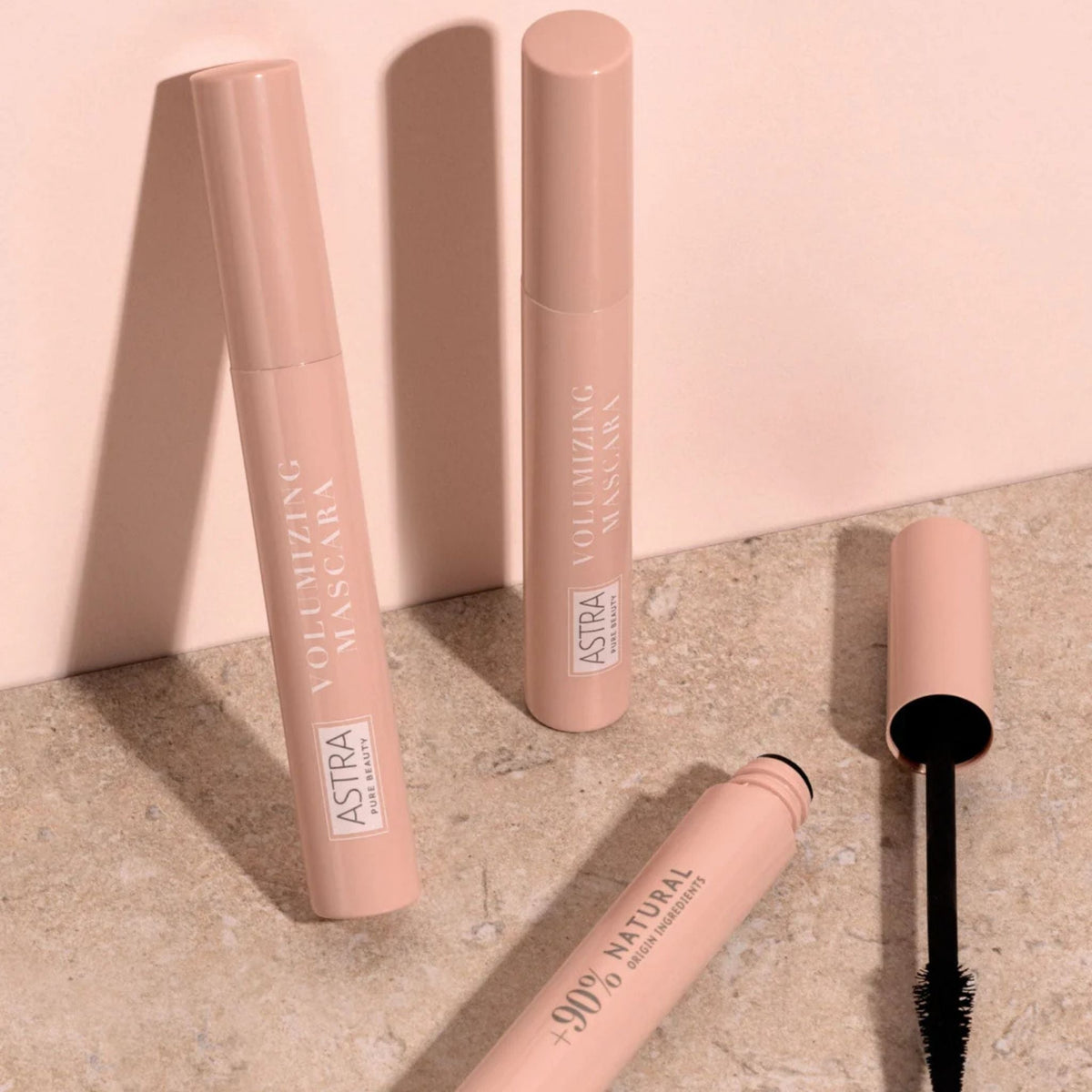 Refect Beauty Astra Pure Beauty Volumizing Mascara tubes in soft pink packaging with a conical brush applicator