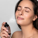 Refect Beauty Astra Zen Routine Fixing Spray being applied to a woman's face for a refreshing makeup setting mist.