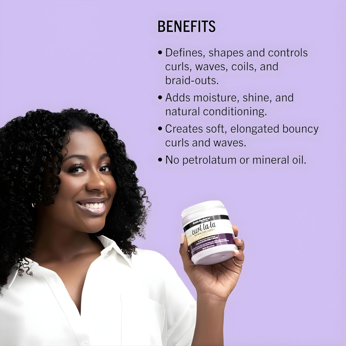 Refect Beauty model holding Aunt Jackie's Curl la la defining curl custard against a light purple background