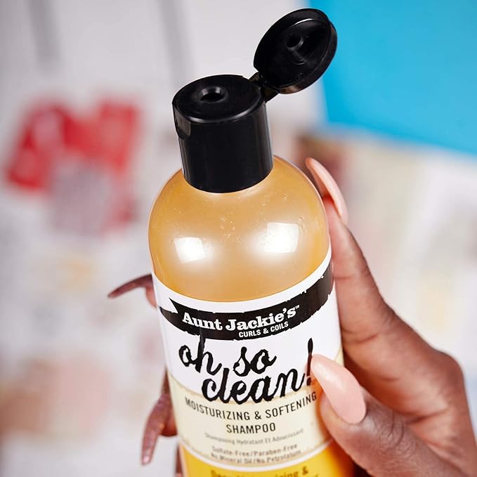 Refect Beauty Aunt Jackie's Oh So Clean moisturizing shampoo bottle held in a hand with a black flip-top cap.
