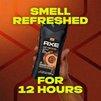 Refect Beauty Axe Dark Temptation 3-in-1 body, hair, and face wash bottle held in hand against a textured orange background