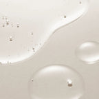 Refect Beauty AXIS-Y Artichoke Intensive Skin Barrier Ampoule serum texture showing clear hydrating droplets on skin